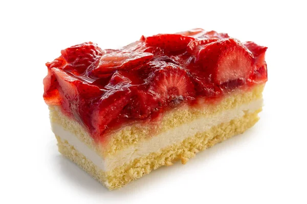 Slice of sponge cake topped with strawberries and jelly isolated — Stock Photo, Image