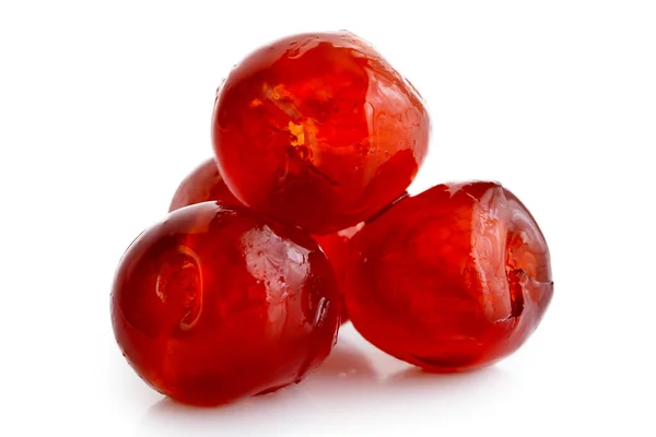 Closeup of four red glace cherries isolated on white. — Stock Photo, Image