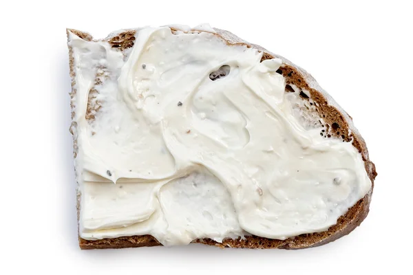 Half slice of rye bread with cream cheese spread isolated on whi — Stock Photo, Image