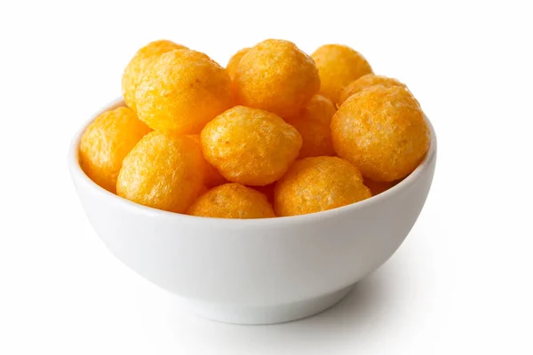 Extruded puffed cheese balls in white ceramic dish isolated on w — Stock Photo, Image