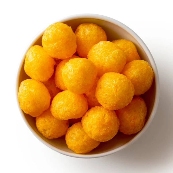 Extruded puffed cheese balls in white ceramic dish isolated on w — Stok Foto