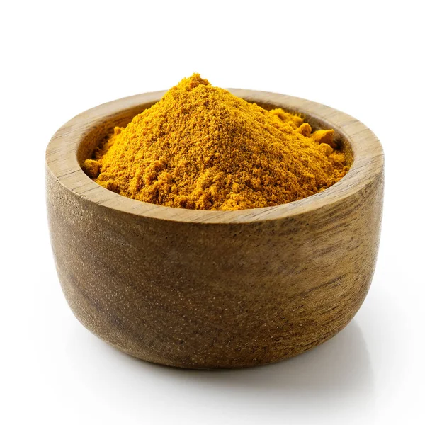 Turmeric powder in dark wood bowl isolated on white. — Stock Photo, Image