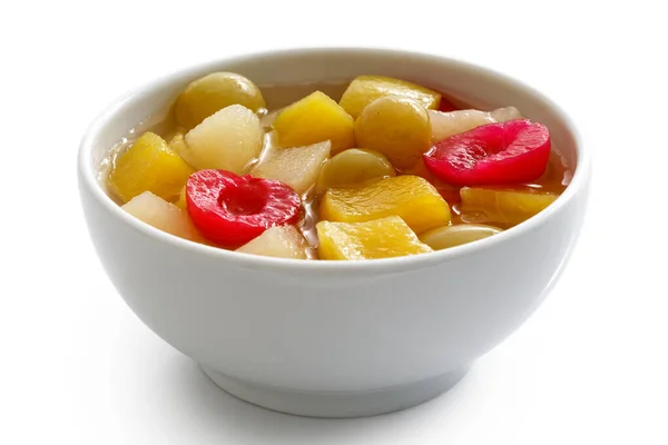 White ceramic bowl of fruit cocktail isolated on white. — ストック写真