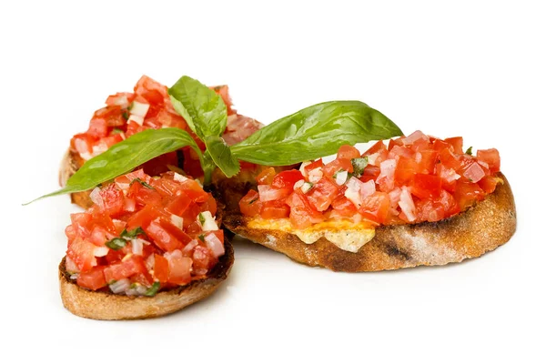 Italian bruschetta with finely chopped tomato and basil. — Stock Photo, Image