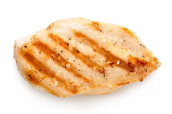 Whole grilled chicken breast with grill marks and ground black p — Stock Photo, Image