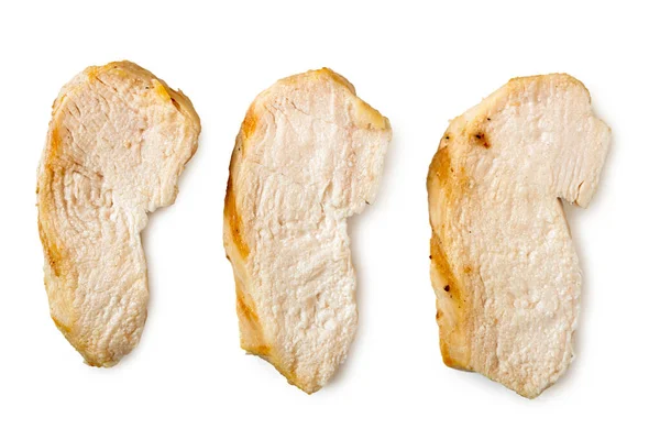 Τρεις ξεχωριστές φέτες στήθος κοτόπουλου στη σχάρα απομονώνονται σε whi — Φωτογραφία Αρχείου