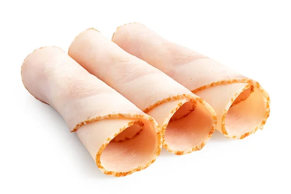 Three rolled up slices of chicken ham isolated on white. — Stock Photo, Image