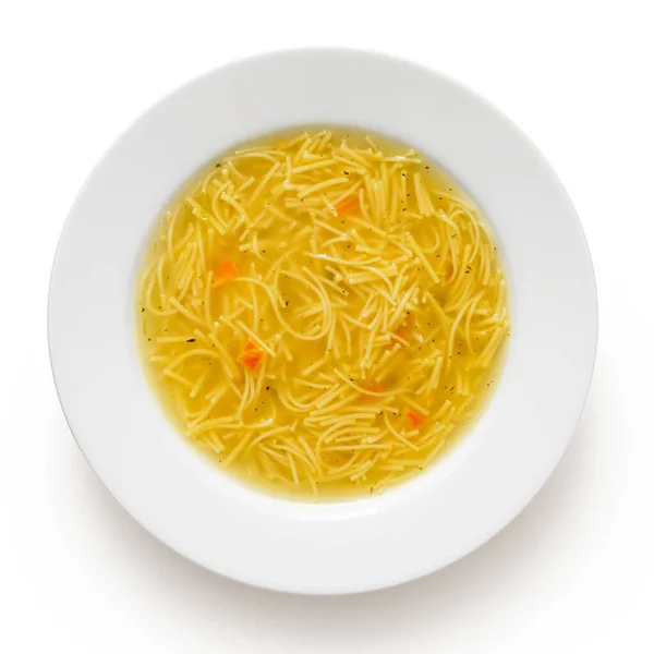 Instant chicken noodle soup in a white ceramic soup plate isolat — Stock Photo, Image