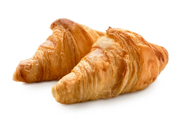 Kaksi paistettua tavallista croissantia, jotka on eristetty valkoiselle . — kuvapankkivalokuva