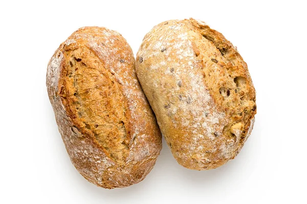 Dois rolos de pão francês de grão inteiro isolados em branco. Vista superior . — Fotografia de Stock