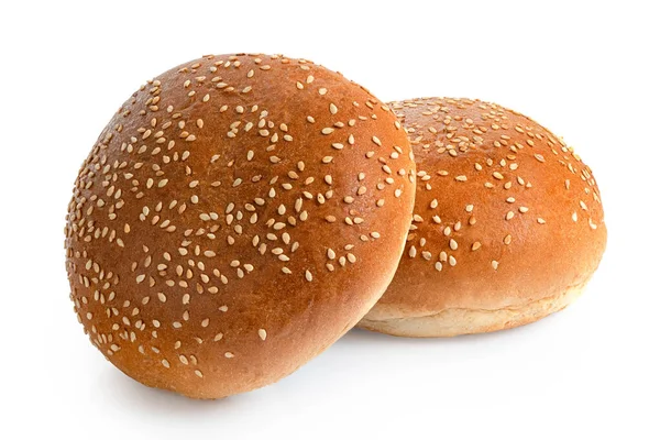Two sesame seed hamburger buns isolated on white. — Stock Photo, Image