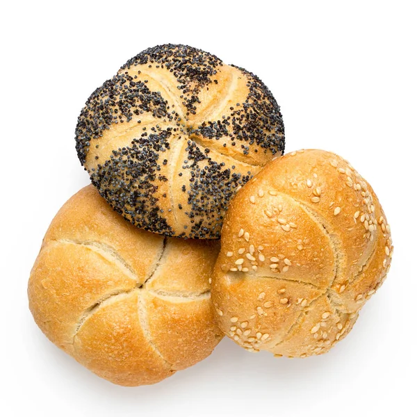 Plain, poppy seed amd sesame seed kaiser rolls isolated on white — Stock Photo, Image