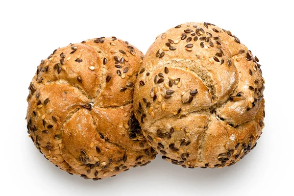 Two traditional whole wheat kaiser rolls with linseeds and sesam — Stock Photo, Image