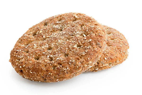 Dois pães planos de trigo de aveia redondo isolados em branco . — Fotografia de Stock