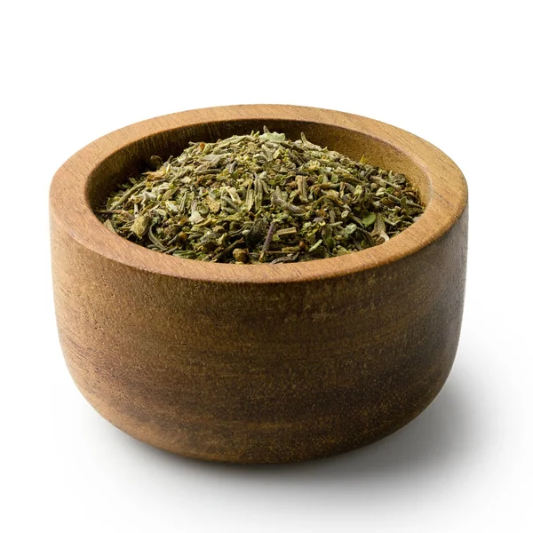Dried chopped provence herbs in a dark wood bowl isolated on whi — Stock Photo, Image