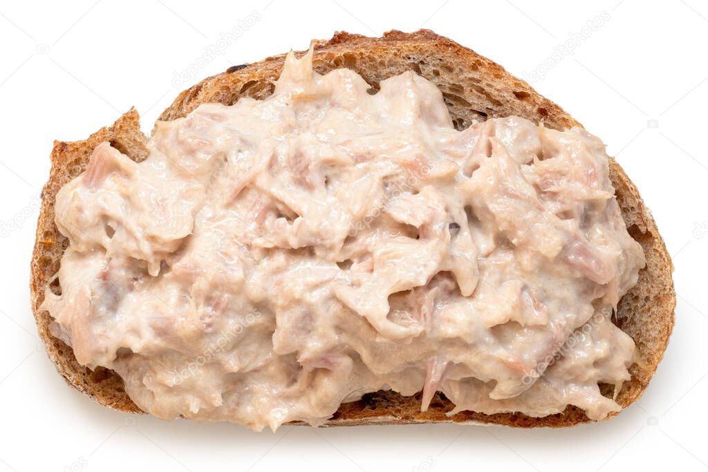 Tuna mayonnaise on wholewheat rustic bread isolated on white. Top view.