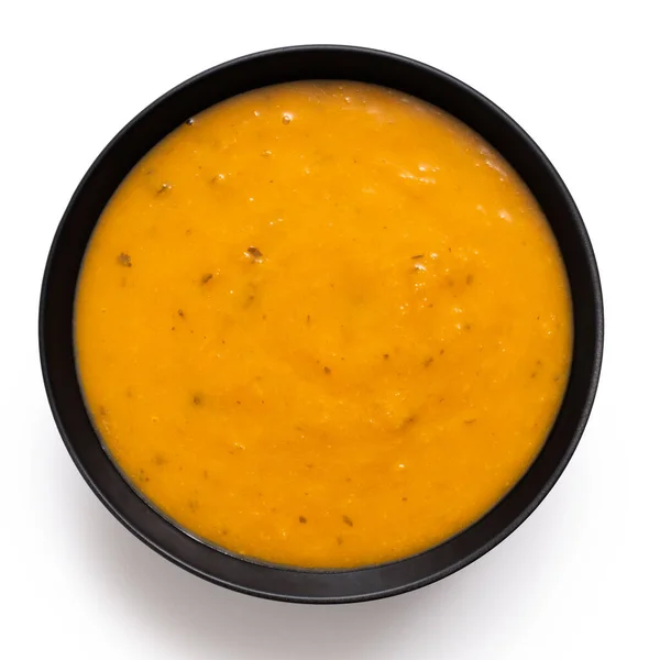 Carrot Coriander Soup Black Ceramic Bowl Isolated White Top View — Stock Photo, Image