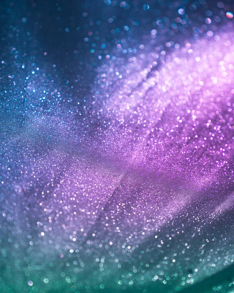 Pembe, mavi ve yeşil parıltı ve bokeh desen arkaplanı