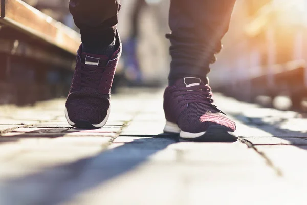 Close up of man sneakers on street