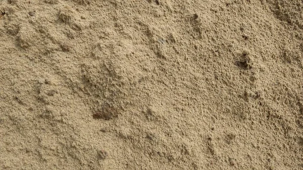 Tekstura piasku. Tło drobnego piasku rzecznego. — Zdjęcie stockowe