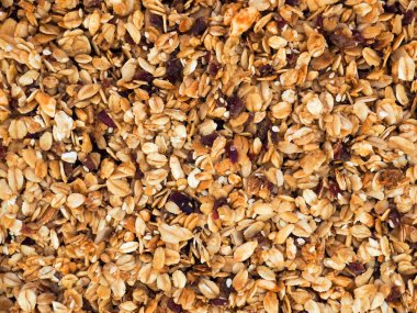 Organik ev yapımı kızartılmış granola ve kızılcık. Kahvaltı için yemek. Yemek arkaplanı, granola dokusu.
