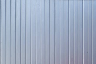 Arka plan galvanize metal profilinden. Oluklu demir bir yaprak..