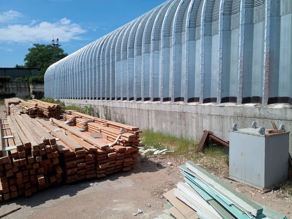 Warehouse of building materials. a Building base, metal, wood and blocks with bricks.