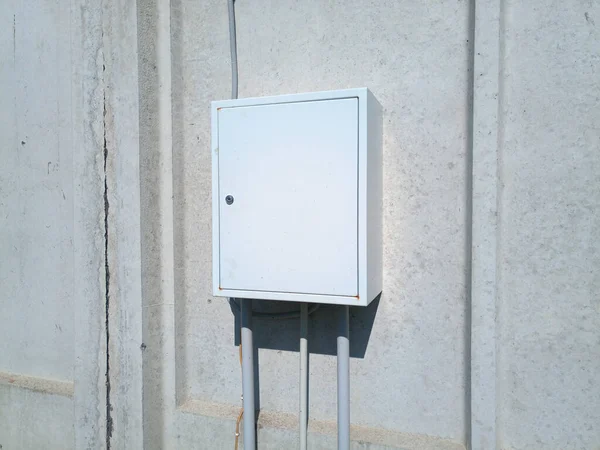 Metal box with an electric flap. An electrical distribution board.