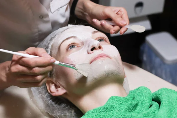 Face peeling mask, spa beauty treatment, skincare.