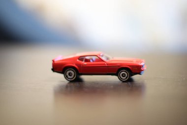 Colored small car toy on a wooden table