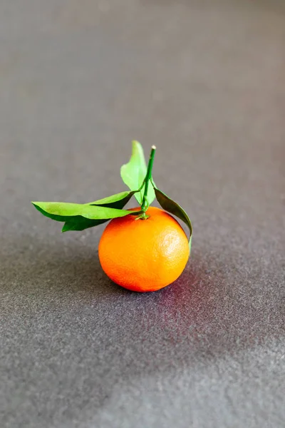 Fresh tangerine or mandarin fruit on grey background — Stock Fotó