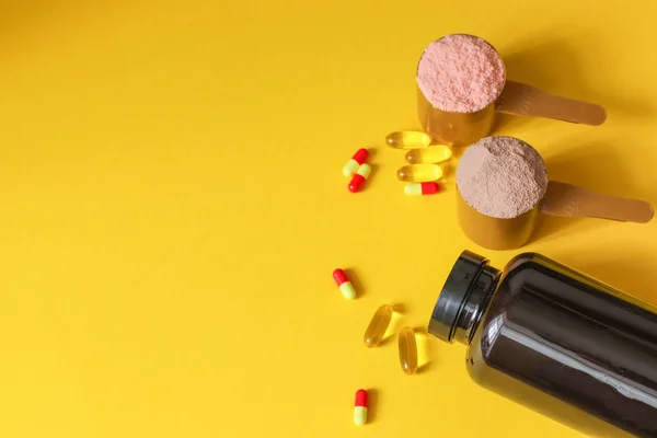 Sports medical vitamins and drugs. Two measuring spoons of whey protein