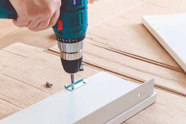 Furniture Assembling Using Battery Drill On White Background. — Stock Photo, Image
