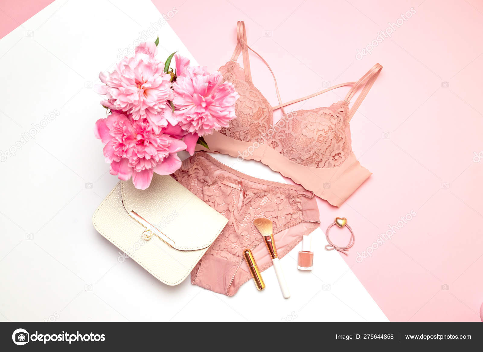 Womens beautiful lacy underwear with accessories, a bouquet of flowers  peonies, handbags on a pink and white background. Stock Photo by  ©irinashatilova 275644858
