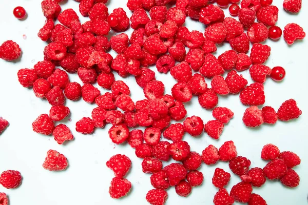 Fresh raspberries background close up. Summer and healthy food concept, Top view or flat lay.