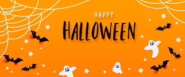 Halloween firande koncept med fladdermöss, Ghost, spindelnät, stjärnor över en orange bakgrund. — Stockfoto