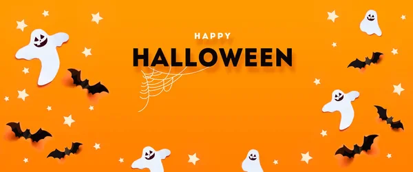 Halloween ünnepség fogalma denevérek, szellem, pókháló, a csillagok egy narancssárga háttér. — Stock Fotó