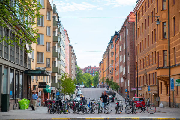 Stockholm, Sweden June 7 2019: City street with bicycles and people on a sunny day.