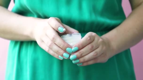 Clean well-groomed hands of a young woman applying hand cream, skin care — Stock Video
