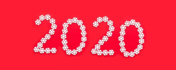 Christmas New Year design concept with 2020 numbers made of white snowflakes on a red background. — ストック写真