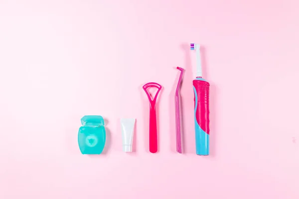 Ultrasonic Pink Toothbrush Dental Floss Mouthwash Tongue Cleaning Pink Background — Stock Photo, Image