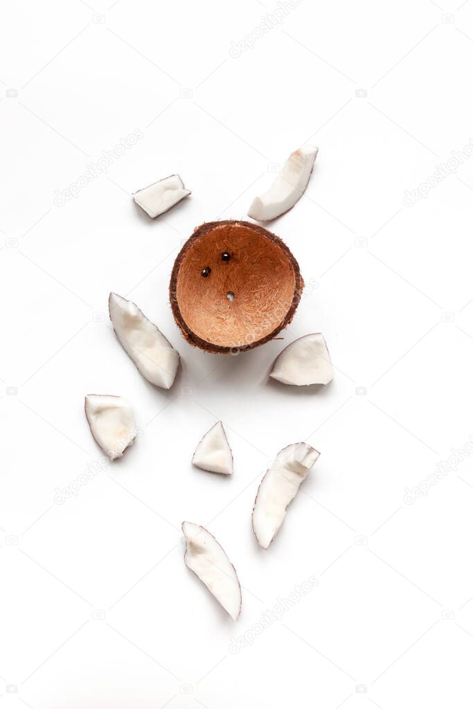 Raw coconut pieces on a white background