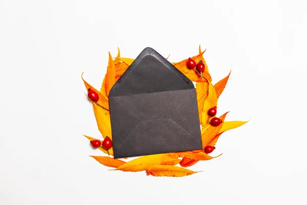 Top View Composition Opened Black Paper Envelope Yellow Red Leaves — Stock Photo, Image