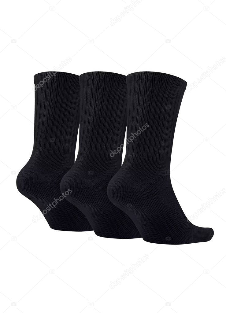 Three black socks isolated on white background. Three pair of socks. Set of short socks for sports on invisible foot as mock up for advertising, branding, design.
