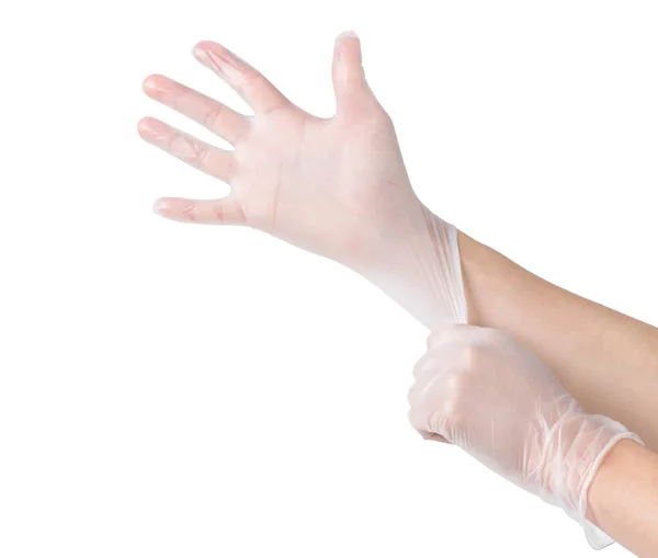 Tıbbi eldivenler. Beyaz arka planda elleri olan iki beyaz ameliyat eldiveni. Lastik eldiven üretimi, insan eli lateks eldiven giyiyor. Doktor ya da hemşire koruyucu eldiven takıyor.