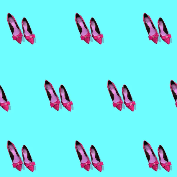 background, pattern with pink women\'s high heel shoes on a blue background