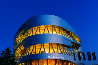 Stuttgart, Germany - September 07, 2018: Mercedes Benz Museum at night. It's an automobile museum that covers the history of Mercedes-Ben. The exceptional was designed by UN Studio clipart