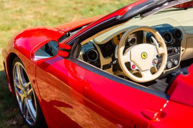 Kerpen, Germany - August 19, 2018: view of a Ferrari sports car with cockpit. Ferrari is an Italian luxury sports car manufacturer based in Maranello, Italy. Founded by Enzo Ferrari 1939 clipart