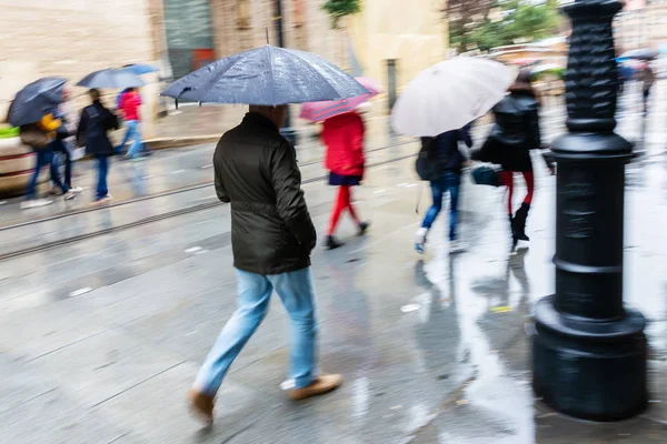 Picture Camera Made Motion Blur People Umbrellas Walking Rainy City — Stock Photo, Image