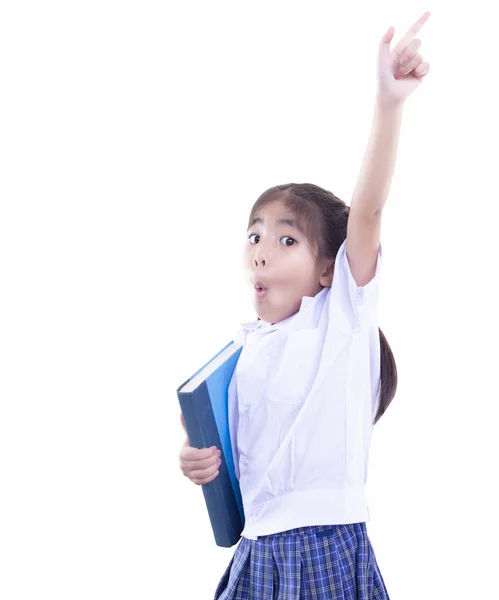 Süße asiatische Schulmädchen halten Buch und zeigen mit dem Finger auf oben — Stockfoto